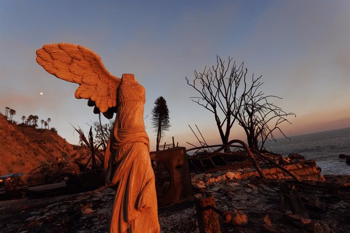 January 11, 2025, Malibu, California, USA: The moon rises above the remains of a destroyed shoreline structure on Pacific Coast Highway as the Palisades fire continues burning and has burned  23, 654 acres with 11% containment and destroyed thousands of s