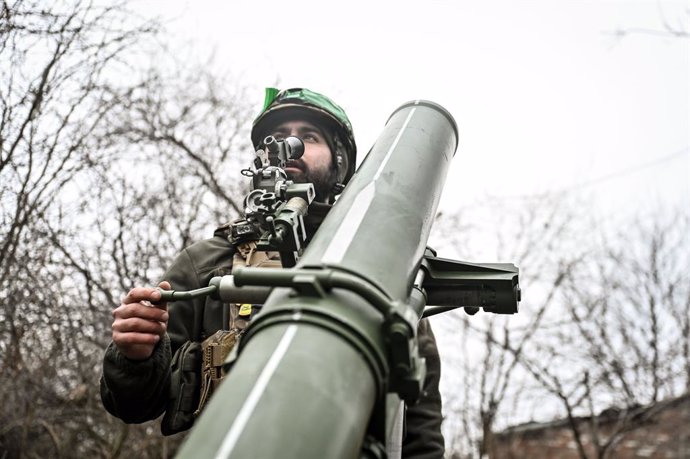 December 20, 2024, Donetsk Region, Ukraine: DONETSK REGION, UKRAINE - DECEMBER 20, 2024 - A serviceman of Ukraine's Khyzhak Patrol Police Special Unit aims a mortar while on a combat mission near Toretsk, Donetsk region, eastern Ukraine.