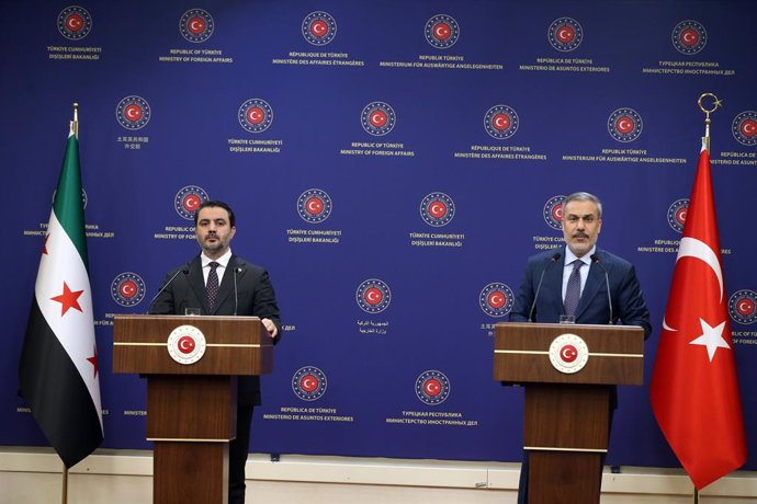 ANKARA, Jan. 15, 2025  -- Turkish Foreign Minister Hakan Fidan (R) and Syria's interim Foreign Minister Asaad Al-Shaibani attend a joint press conference in Ankara, Trkiye, on Jan. 15, 2025. Syria's interim Foreign Minister Asaad Al-Shaibani met with Tu