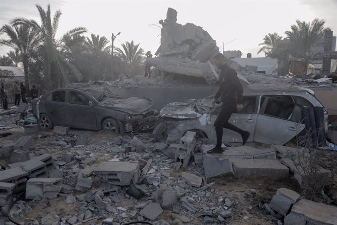 GAZA, Jan. 15, 2025  -- A Palestinian man walks among the rubble at the site of destroyed houses after an Israeli bombardment in Deir al-Balah, central Gaza Strip, on Jan. 15, 2025. Israel and Hamas have agreed to a Gaza ceasefire-for-hostages deal follow