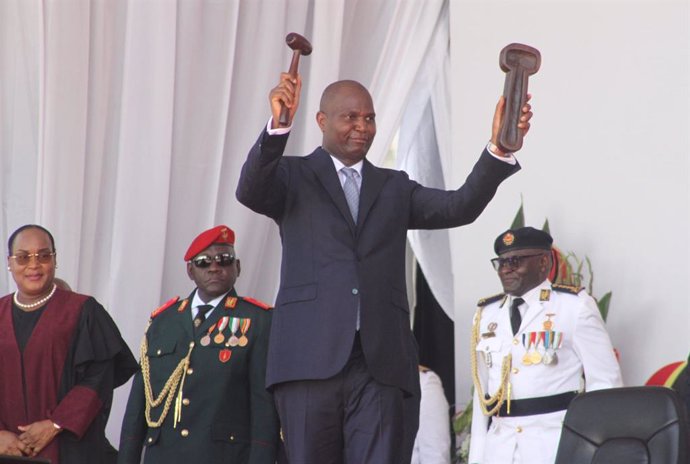 MAPUTO, Jan. 15, 2025  -- The newly sworn-in President of Mozambique Daniel Francisco Chapo demonstrates the symbol of power he received from Lucia Ribeiro, president of the Constitutional Council, during an inauguration ceremony in Maputo, Mozambique, on