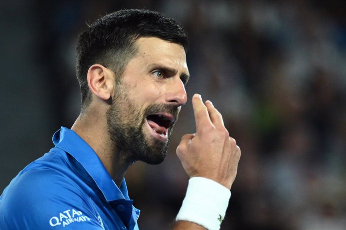 21 January 2025, Australia, Melbourne: Serbia's Novak Djokovic reacts during his men's singles quarterfinal tennis match against Spain's Carlos Alcaraz on day ten of the Australian Open tennis tournament at Melbourne Park. Photo: Joel Carrett/AAP/dpa