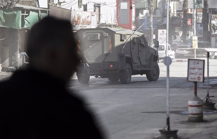 JENIN, Jan. 21, 2025  -- An Israeli military vehicle is seen during an Israeli military operation in the West Bank city of Jenin, on Jan. 21, 2025. Six Palestinians have been killed and 35 others injured in a major Israeli military operation launched Tues