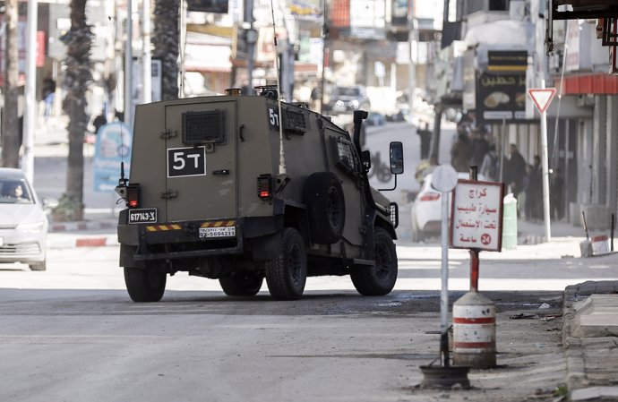 JENIN, Jan. 21, 2025  -- An Israeli military vehicle is seen during an Israeli military operation in the West Bank city of Jenin, on Jan. 21, 2025. Six Palestinians have been killed and 35 others injured in a major Israeli military operation launched Tues