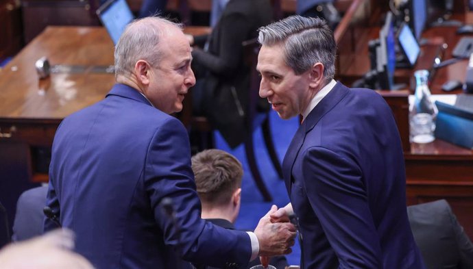 22 January 2025, Ireland, Dublin: Fine Gael leader Simon Harris TD (R) and Fianna Fail leader Micheal Martin can be seen in the Dail chamber ahead of the vote on Martin's appointment as Taoiseach. Photo: Fergal Phillips/Maxwells/PA Media/dpa