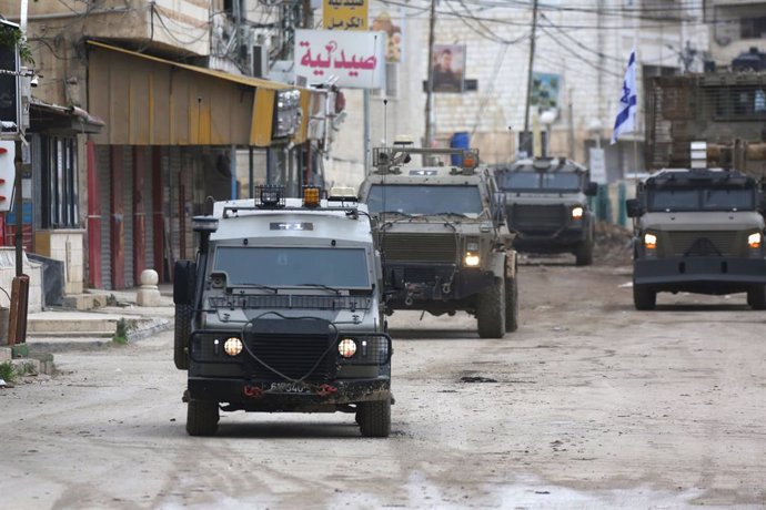 JENIN, Jan. 22, 2025  -- Israeli military vehicles are seen during an Israeli military operation in the West Bank city of Jenin, on Jan. 22, 2025. Israel continued its military operation in Jenin for a second day, killing at least ten people, the military