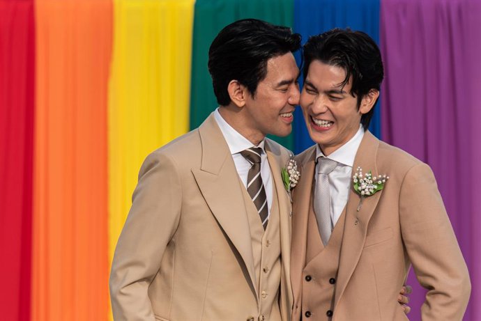 January 23, 2025, Bangkok, Thailand: Thai LGBT couple, Thai actors, Apiwat  Apiwatsayree (L) and Sappanyoo  Panatkool (R) seen pose for a photo after registering their same-sex marriage at the Phra Nakhon district office in Bangkok. Thailand is the first 