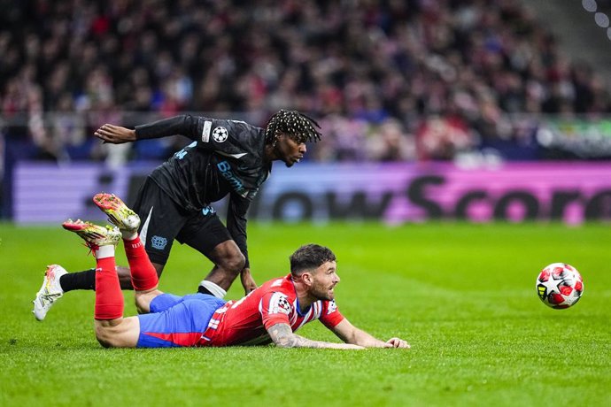 Jeremie Frimpong of Bayer Leverkusen and Javi Galan of Atletico de Madrid in action during the UEFA Champions League 2024/25 League Phase MD7 match between Atletico de Madrid and Bayer 04 Leverkusen at Riyadh Air Metropolitano stadium on January 21, 2025,