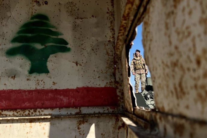 BEIJING, Jan. 15, 2025  -- A Lebanese army soldier is seen after the withdrawal of Israeli army in Tayr Harfa, Lebanon, on Jan. 13, 2024.   The Lebanese army announced on Saturday that its units have completed their deployment in several towns and village