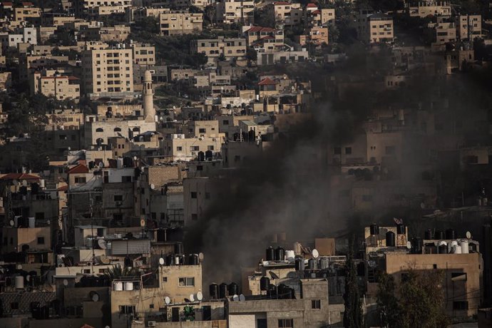 January 24, 2025, Jenin, West Bank, Palestinian Territory: Smoke from an explosion billows as homes are demolished in Jenin refugee camp in the West Bank during an Israeli military operation, Friday, Jan. 24, 2025