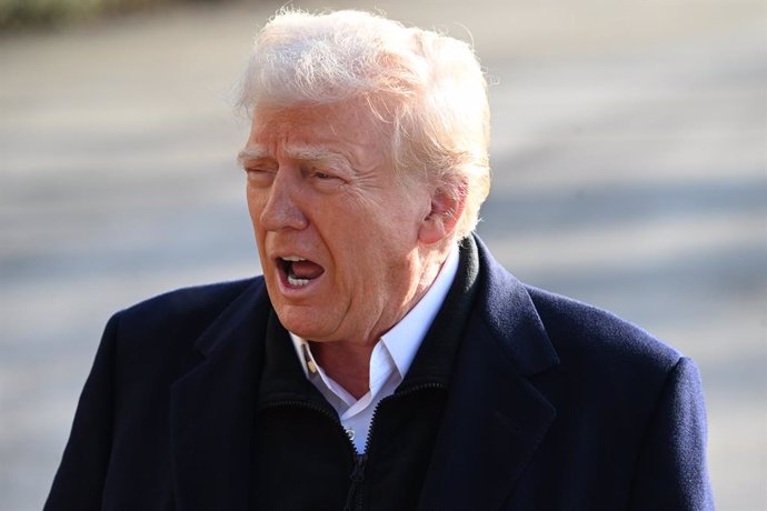 24 January 2025, US, Washington, D.C: US President Donald Trump (L) takes questions from the press on the South Lawn of the White House prior to departing on marine one for the first trip of his second term to North Carolina and California. Photo: Kyle Ma