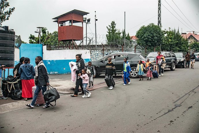 GOMA, Jan. 26, 2025  -- The United Nations (UN) staff and their family are seen outside the UN peacekeeping mission bureau in Goma, North Kivu province, eastern Democratic Republic of the Congo (DRC), Jan. 25, 2025. The United Nations announced on Saturda