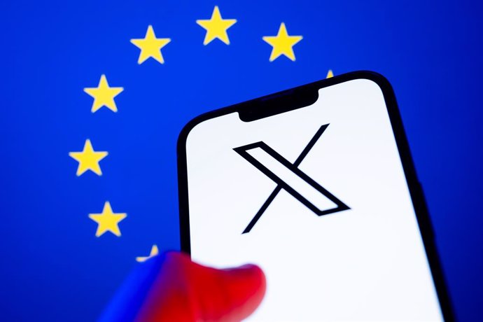 January 11, 2025, Poland: In this photo illustration, a X (Twitter) logo seen displayed on a smartphone with European Union flag in the background.