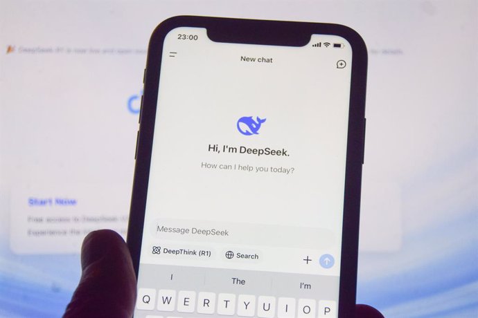 27 January 2025, United Kingdom, London: In this photo illustration, the DeepSeek app is seen on a phone screen with the DeepSeek website in the background. Major US technology firms have seen their shares fall as Chinese developers launch the low-cost De