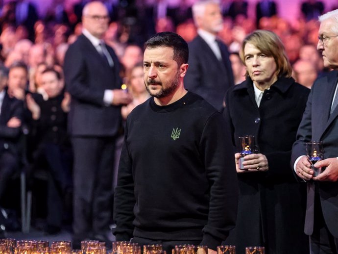 January 27, 2025, Oswiecim, Malopolskie, Poland: President of Ukraine, Volodymyr Zelensky leaves candles by a symbolicÂ Nazi transport wagon in Auschwitz - Birkenau Museum, former Nazi German Auschwitz Concentration and Extermination Camp during the 80th 