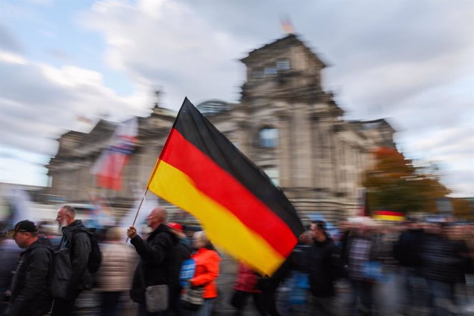  On February 23, Germany elects a new Bundestag. Seen here at a demonstration in front of the Reichstag building in Berlin, the seat of the Bundestag, in 2022.