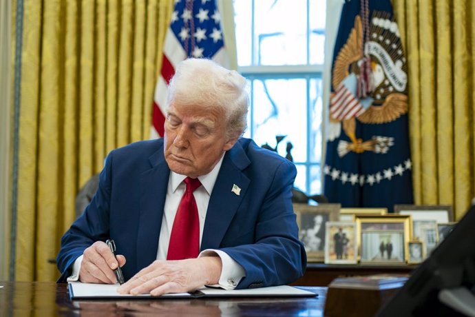 January 30, 2025, Washington, District Of Columbia, USA: United States President Donald Trump signs two executive orders in the Oval Office of the White House in Washington, DC on Thursday, January 30, 2025. The first order formally commissioned Christoph