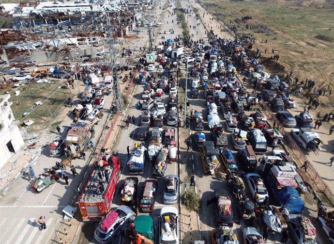 January 27, 2025, Dair El-Balah, Gaza Strip, Palestinian Territory: Aerial footage shows displaced Gazans walking toward Gaza City on January 27, 2025, after crossing the Netzarim corridor from the southern Gaza Strip. An unending stream of people marched