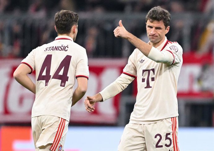 29 January 2025, Bavaria, Munich: Munich's Thomas Mueller (R) celebrates scoring his side's first goal with teammate Josip Stanisic during the UEFA Champions League soccer match between Bayern Munich and Slovan Bratislava at the Allianz Arena. Photo: Sven