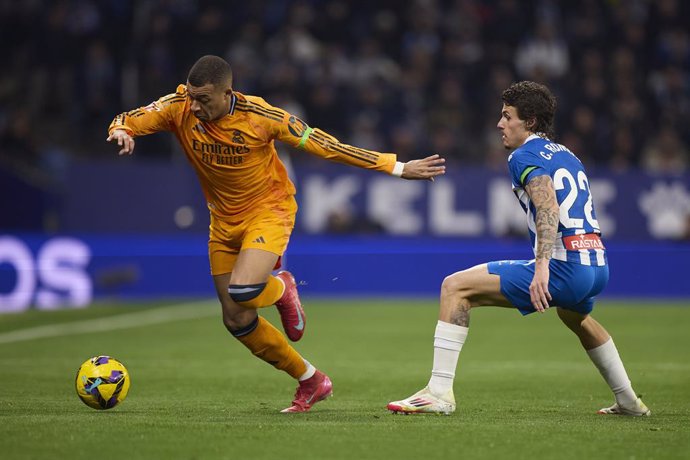 Kylian Mbappe of Real Madrid CF competes for the ball with Carlos Romero of RCD Espanyol during the LaLiga EA Sports match between RCD Espanyol and Real Madrid CF at RCDE Stadium on February 1, 2025, in Barcelona, Spain.