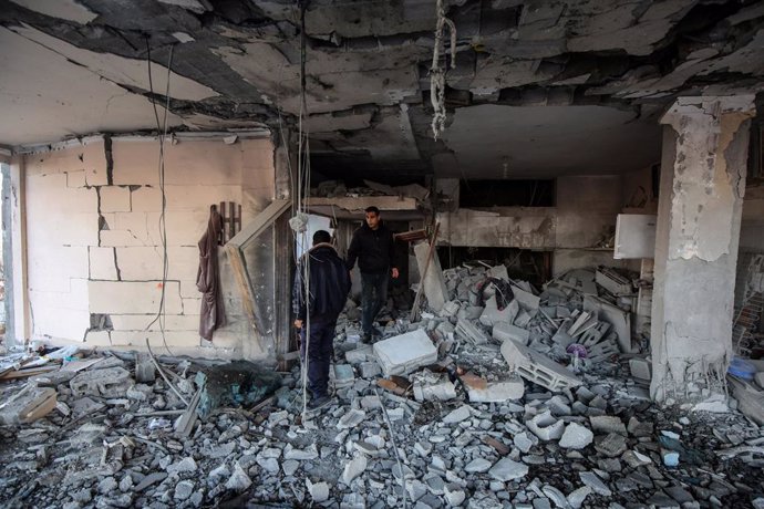 DEIR AL-BALAH, Jan. 8, 2025  -- Palestinians are seen at the site of a destroyed house after an Israeli bombardment, in Deir al-Balah, central Gaza Strip, on Jan. 8, 2025. At least 31 Palestinians were killed in the latest Israeli attacks across the Gaza 