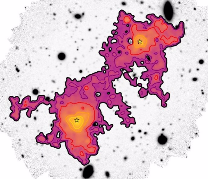 La imagen muestra el gas difuso (de amarillo a púrpura) contenido dentro del filamento cósmico que conecta dos galaxias (estrellas amarillas), extendiéndose a lo largo de una vasta distancia de 3 millones de años luz.