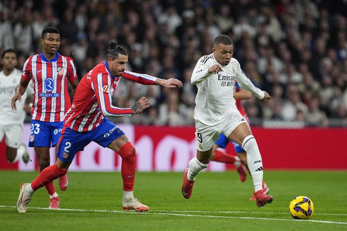 Kylian Mbappe of Real Madrid and Jose Maria Gimenez of Atletico de Madrid in action during the Spanish League, LaLiga EA Sports, football match played between Real Madrid and Atletico de Madrid at Santiago Bernabeu stadium on February 8, 2025, in Madrid, 