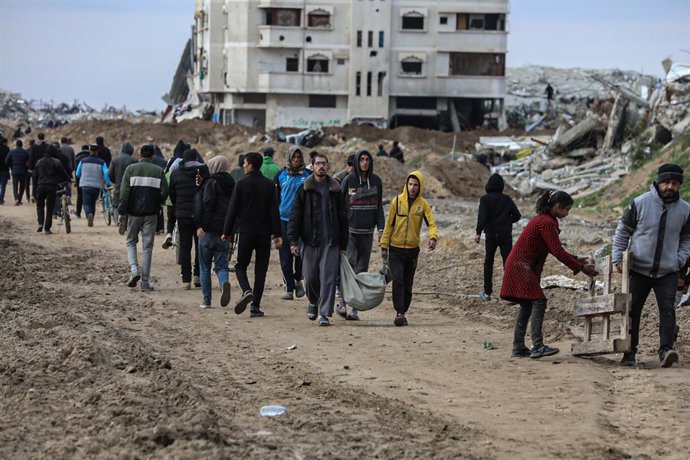 February 9, 2025, Gaza City, Gaza Strip, Palestinian Territory: Palestinians inspect the destruction after the Israeli army withdrew from the Netzarim corridor, as part of a ceasefire agreement with Hamas in Gaza City, Gaza on February 9, 2025. The Israel