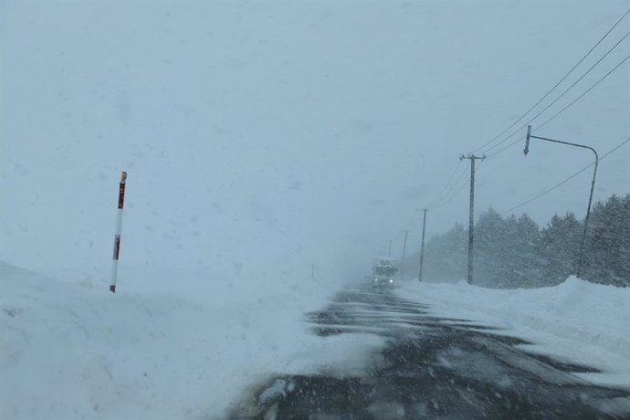 SAPPORO, Feb. 4, 2025  -- A road is partially covered by snow in the outskirts of Sapporo, Hokkaido, Japan, Feb. 4, 2025. A rapidly intensifying low-pressure system has brought record-breaking snowfall to Japan's Hokkaido, with Obihiro City witnessing ove