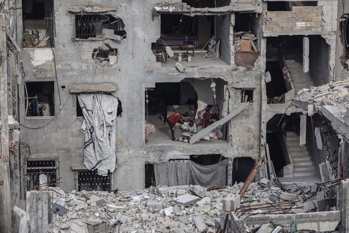 February 3, 2025, Gaza City, Gaza Strip, Palestinian Territory: Internally Palestinians walk along a street among the rubble of destroyed buildings amid a ceasefire between Israel and Hamas, in Gaza City, 03 February 2025. Israel and Hamas implemented the