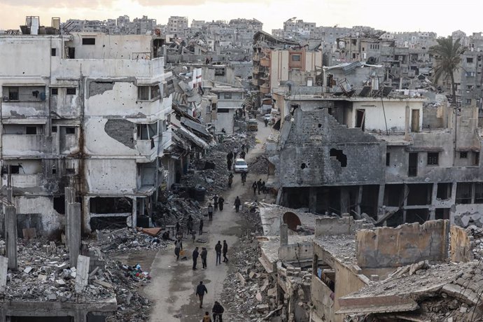 February 8, 2025, Gaza City, Gaza Strip, Palestinian Territory: Palestinians walk along a street among the rubble of destroyed buildings amid a ceasefire between Israel and Hamas, in Gaza City, 08 February 2025. Israel and Hamas implemented the first phas