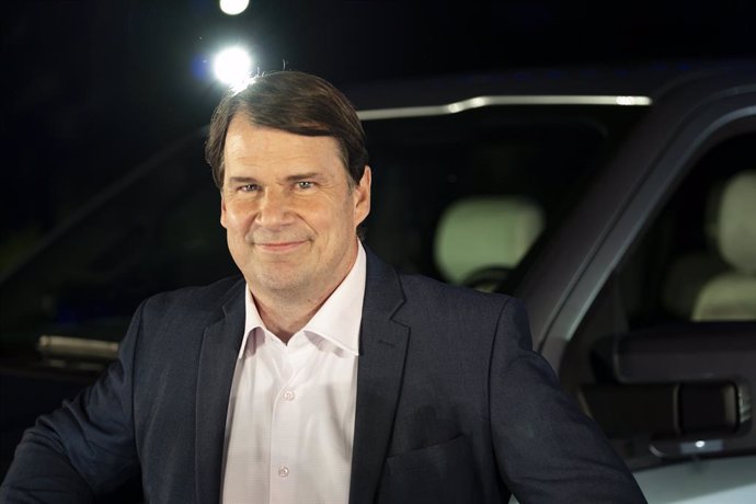 Archivo - 19 May 2021, US, Dearborn: Ford Motor Company CEO Jim Farley poses next to the new all-electric F-150 Lightning pickup truck at an event to unveil the new F-150 Lightning all-electric pickup truck at the Ford World Headquarters. The new F-150 Li