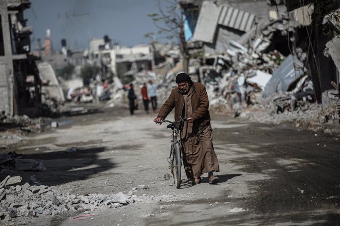 February 14, 2025, Bureij, Gaza Strip, Palestinian Territory: A view of the demolished residential area shows Palestinians continuing their daily lives under difficult conditions in the Bureij refugee camp, struggling to survive amid the rubble of buildin