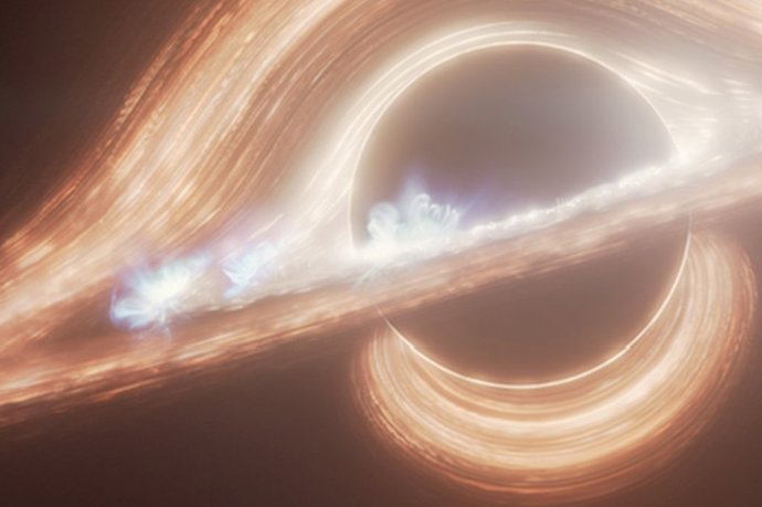 Esta concepción artística retrata el agujero negro supermasivo que se encuentra en el centro de la Vía Láctea. En el disco se ven varios puntos calientes que se asemejan a las erupciones solares, pero a una escala más energética.