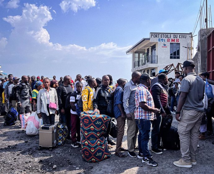 GOMA, Feb. 19, 2025  -- People wait in line to get on board at a dock in Goma, the Democratic Republic of the Congo (DRC), Feb. 18, 2025.   Traffic on Lake Kivu between Bukavu and Goma, two provincial capitals in the eastern Democratic Republic of the Con