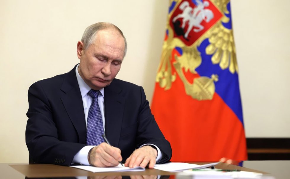 February 14, 2025, Odintsovsky District, Moscow Oblast, Russia: Russian President Vladimir Putin, takes notes during a video conference meeting with Sevastopol Governor Mikhail Razvozhayev from the Novo-Ogaryovo state residence, February 14, 2025 in 
