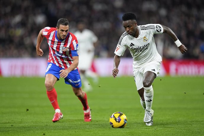 Vinicius Junior of Real Madrid and Jorge Resurreccion Koke of Atletico de Madrid in action during the Spanish League, LaLiga EA Sports, football match played between Real Madrid and Atletico de Madrid at Santiago Bernabeu stadium on February 8, 2025, in M