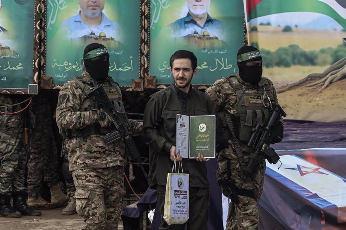 February 22, 2025, Nuseirat, Gaza Strip, Palestinian Territory: The Al-Qassam Brigades, the military wing of Hamas, handed over the three Israeli hostages, Omer Shem-Tov, Ilya Cohen, and Omer Winkert, to the International Committee of the Red Cross, as pa