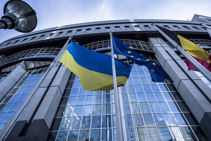 February 19, 2025, Brussels, Bxl, Belgium: Ukrainian, European Union, and Belgian flags wave in front of the European Parliament building in Brussels, Belgium on 19/02/2025 by Wiktor Dabkowski