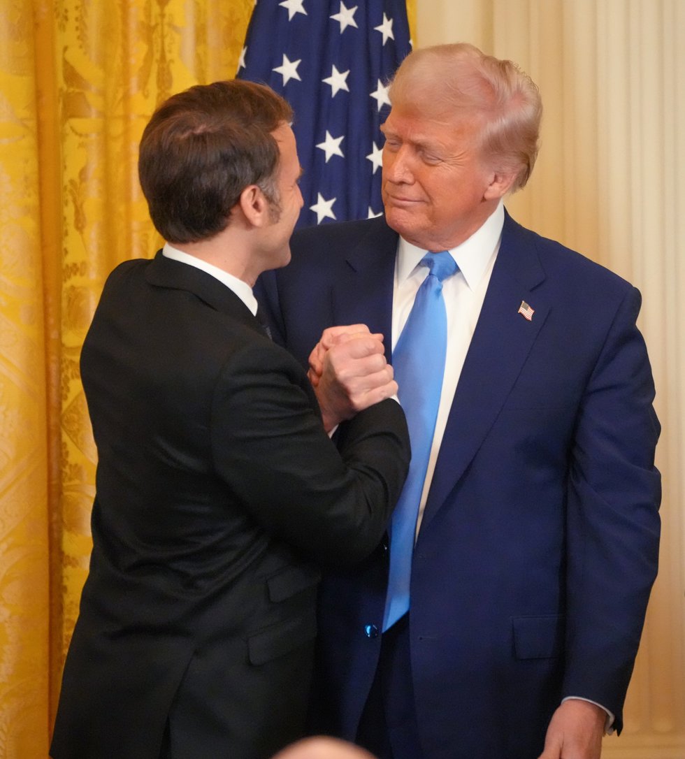 24 February 2025, US, Washington: US President Donald Trump and French President Emmanuel Macron shake hands after a joint press conference in the East Room of the White House following a bilateral meeting. Photo: Andrew Leyden/ZUMA Press Wire/dpa