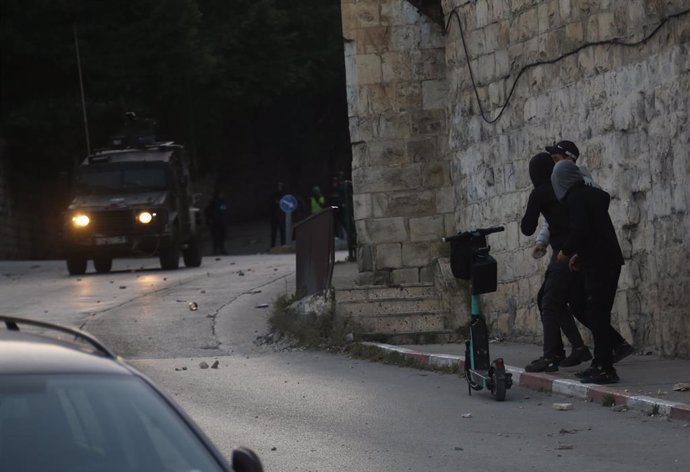 NABLUS, Feb. 25, 2025  -- Palestinian youths are seen during clashes with Israeli forces in the West Bank city of Nablus, on Feb. 25, 2025.