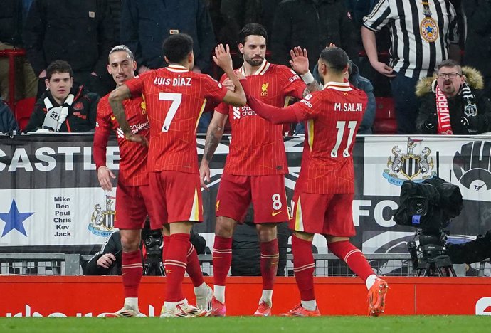 26 February 2025, United Kingdom, Liverpool: Liverpool's Dominik Szoboszlai (C) celebrates scoring their side's first goal of the game during the English Premier League soccer match between Liverpool and Newcastle United at Anfield. Photo: Peter Byrne/PA 