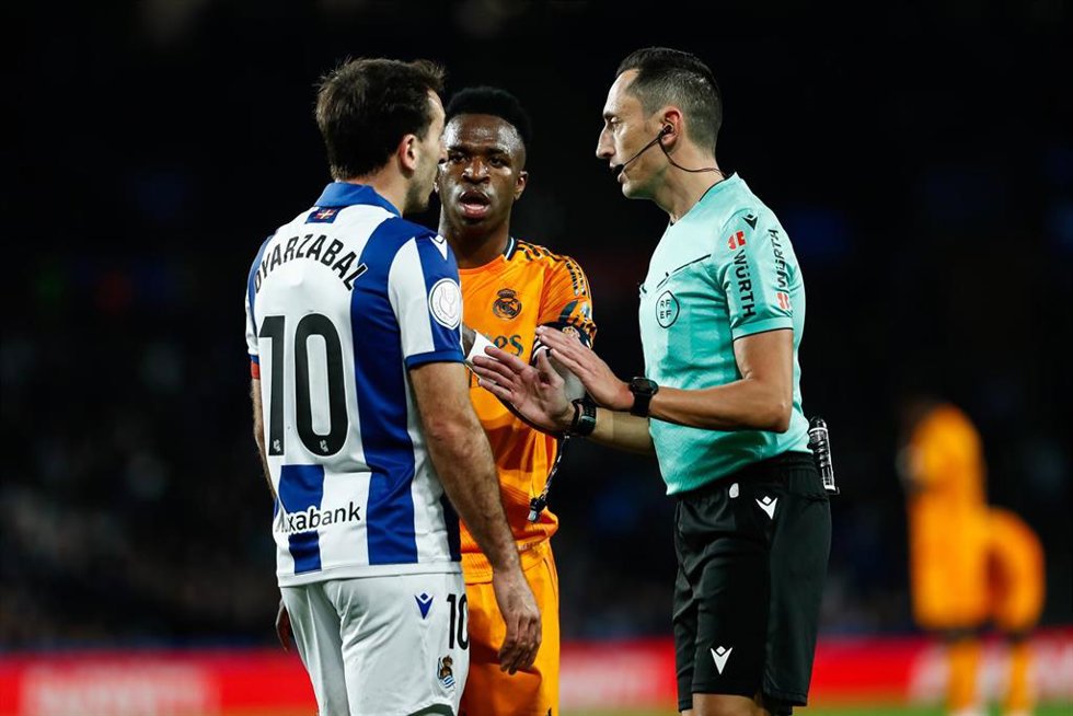 Mikel Oyarzabal of Real Sociedad and Vinicius Junior of Real Madrid talk to Jose Maria Sanchez Martinez, referee of the match, during the Spanish Cup, Copa del Rey, semi-final football match played between Real Sociedad and Real Madrid at Reale Arena st