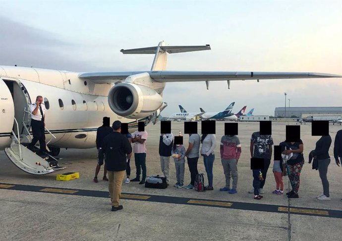 February 11, 2025: Migrants, their faces obscured, outside the plane that ferried them from Texas to Martha's Vineyard, Massachusetts. Florida taxpayers paid for the charter.