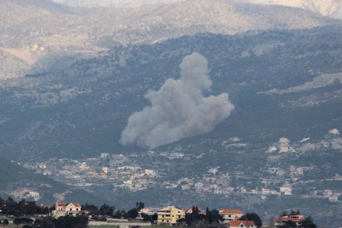 KFAR HAMAM, Feb. 17, 2025  -- This photo shows the smoke caused by Israeli attacks in Kfar Hamam, Lebanon, on Feb. 16, 2025.   Israel's military said on Sunday evening that its warplanes struck sites in Lebanon, claiming they were Hezbollah military posit