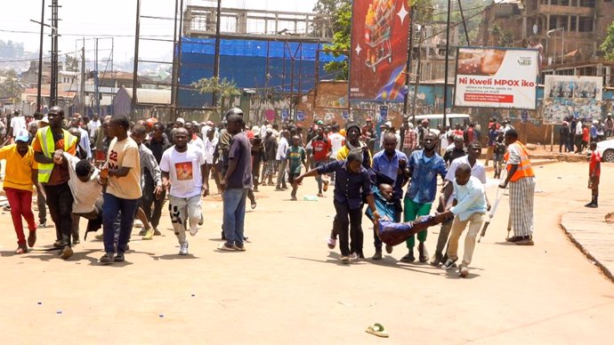 BUKAVU, Feb. 27, 2025  -- The screenshot from a video shows people transferring injured people after explosions in Bukavu, South Kivu Province, the Democratic Republic of the Congo (DRC), on Feb. 27, 2025. Several explosions killed at least 11 people and 