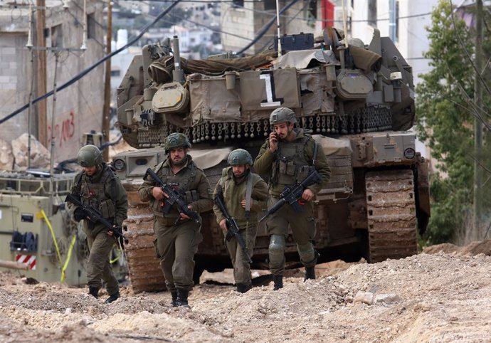 JENIN, Feb. 24, 2025  -- Israeli soldiers are seen during a military operation in the West Bank city of Jenin, on Feb. 24, 2025. Israeli Defense Minister Israel Katz on Sunday ordered the military to prepare for a yearlong presence in refugee camps in the