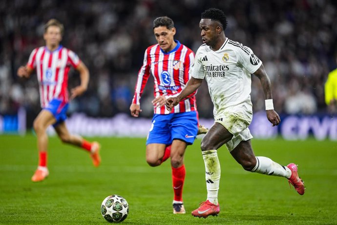 Vinicius Junior of Real Madrid in action during the UEFA Champions League 2024/25  League Round of 16 First Leg match between Real Madrid CF and Atletico de Madrid, at Santiago Bernabeu stadium on March 04, 2025, in Madrid, Spain.