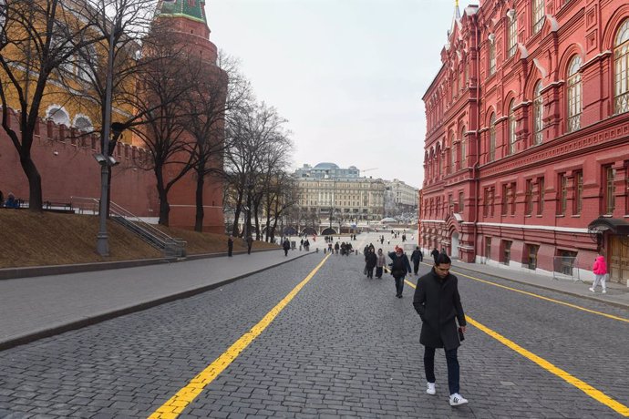 March 10, 2025, Moscow, Russia: People stroll along Red Square near the Kremlin, the Corner Arsenal Tower and the historical Museum.