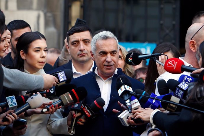 BUCHAREST, March 7, 2025  -- Calin Georgescu (C) addresses the media after registering his candidacy for presidential election at the Central Electoral Bureau in Bucharest, Romania, on March 7, 2025. Former Romanian presidential election front-runner Cali